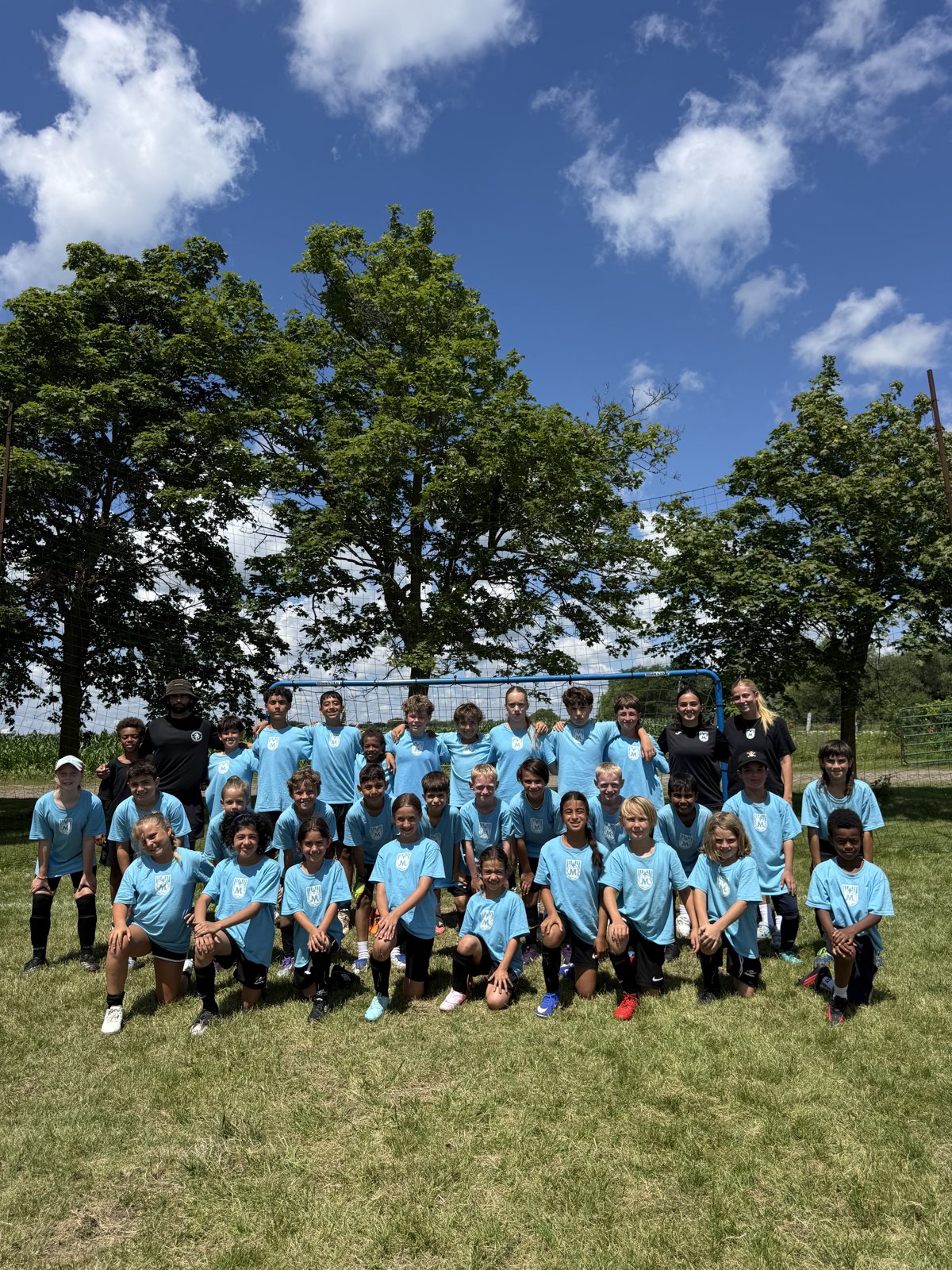 July 2026 Maravilha summer camp team photo in front of the goal