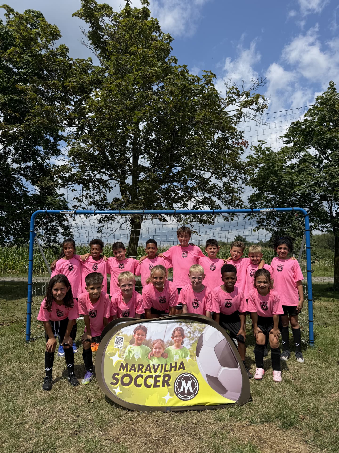 August 2026 Maravilha summer camp team photo in front of the goal